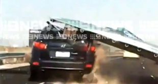 highway accident video sign board falls on car